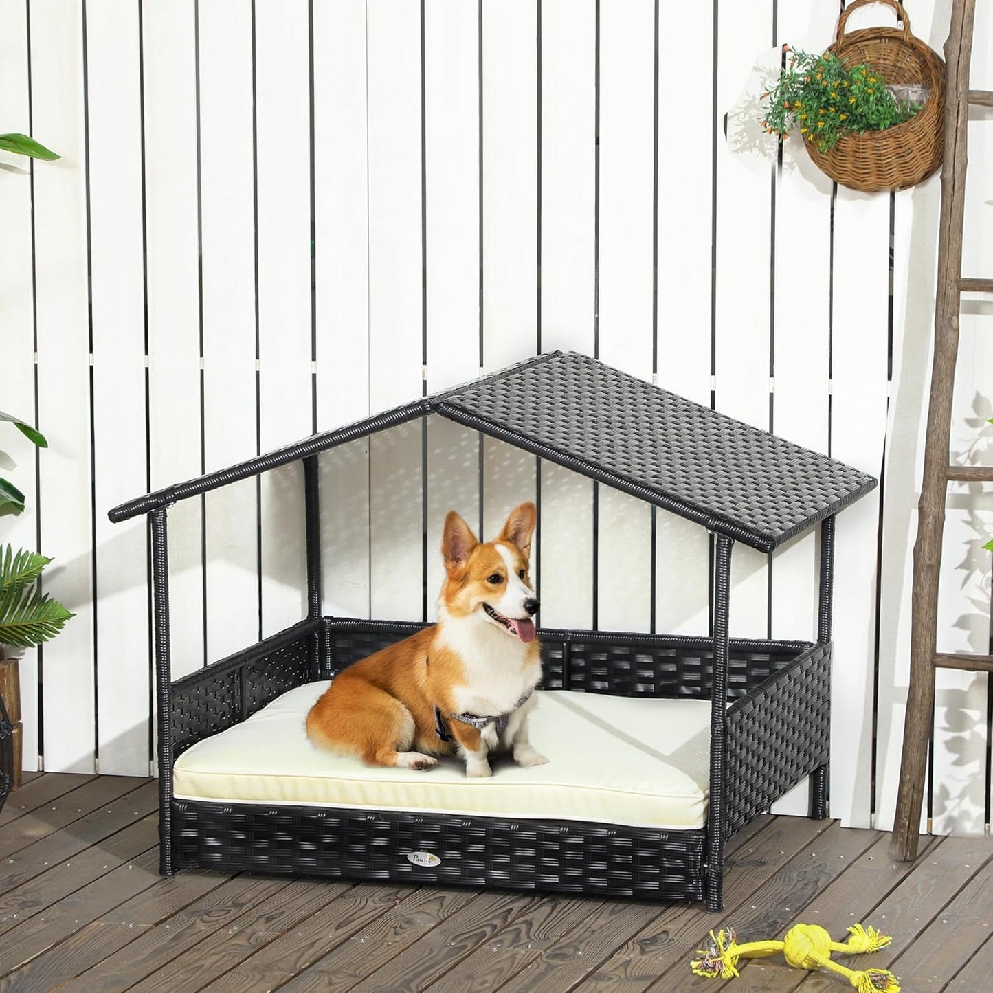 PawHut Wicker Dog House Outdoor with Canopy, Rattan Dog Bed with Water-Resistant Cushion, Raised Dog Bed for Small, Medium Dogs up to 66 lbs, 19.75" in Length, Black Wicker, White Cushion